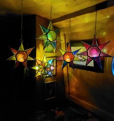 three star shaped lights hanging from the ceiling