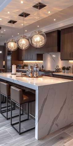 a large kitchen with marble counter tops and bar stools