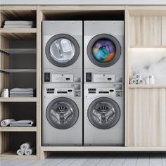 a washer and dryer in a room with wooden shelves on either side of the door