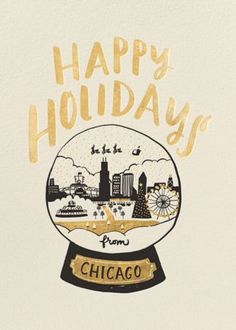 a snow globe with the words happy holidays written in gold on it and an image of chicago