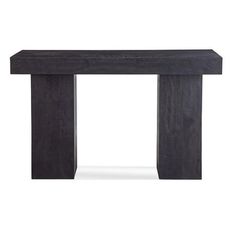 a black wooden table sitting on top of a white floor