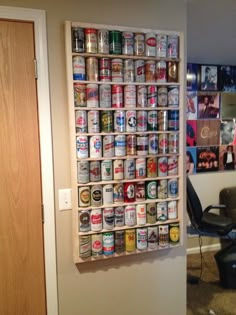 a wall mounted beer can display in an office