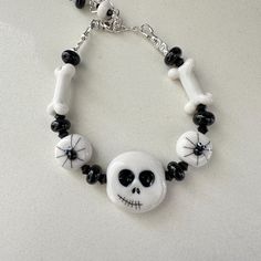 a skull bracelet with black and white beads