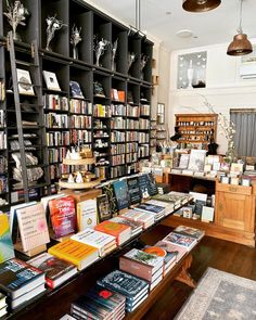 a room filled with lots of books on shelves