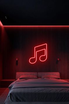 a bed in a room with red lighting and a musical note sign on the wall