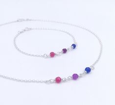 "Handmade sterling silver jewellery set. Necklace och bracelet. Different colored crystal beads making up the bisexual pride flag. Delicate silver chain. Sizing instructions: Necklace: Order at least 2.5 cm (1\") longer than the intended wearers neck for a tight fit. Longer for a looser fit. Bracelet: Order 1.5 cm (1/2\") longer than the intended wearers wrist for a proper fit. Stand alone bracelet: https://www.etsy.com/listing/1024658633 Stand alone necklace: https://www.etsy.com/listing/101068 Lgbtq Necklace, Bisexual Pride Flag, Beads Making, Leather Choker Necklace, Infinity Jewelry, Silver Choker Necklace, Crystal Jewelry Sets, Heart Choker, Symbolic Jewelry