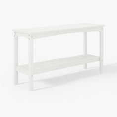 a white bench sitting on top of a white floor