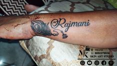 a person with a tattoo on their arm that says ragnari and an arrow