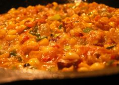 a pan filled with food sitting on top of a stove