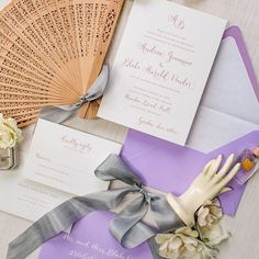 the wedding stationery is laid out on the table