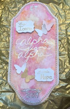 a pink and gold tag with butterflies on it that says hope, hope, hope