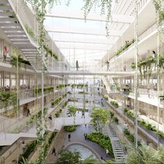 an atrium filled with lots of plants and people