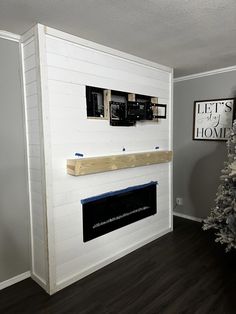 there is a fireplace in the living room that has been painted white with black trim