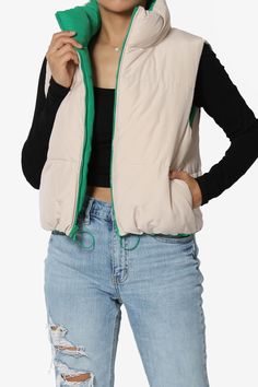 Elevate your winter style with TheMogan Junior's Winter Warm Reversible Puffer Crop Vest.This trendy and versatile sleeveless padded jacket features a reversible design, allowing you to switch up your look effortlessly.The padded construction provides warmth and comfort during colder months. With its sleeveless design, it can be easily layered over sweaters or long-sleeve tops.Perfect for casual outings or outdoor activities, this jacket is a must-have for any fashion-forward individual. Stay co Sleeveless Nylon Puffer Jacket For Spring, Spring Nylon Puffer Vest, Trendy Green Vest Outerwear, Spring Outdoor Puffer Vest, Sleeveless Puffer Jacket For Spring, Trendy Sleeveless Winter Puffer Jacket, Trendy Nylon Spring Vest, Trendy Nylon Vest For Spring, Trendy Spring Nylon Vest