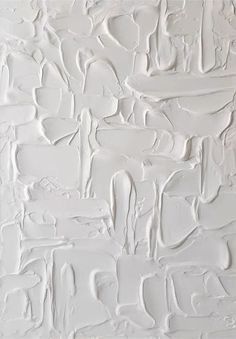 white paint is being used to create an abstract pattern on the wall in this room