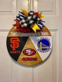 a door hanger with the san francisco giants and san francisco chargers logos on it