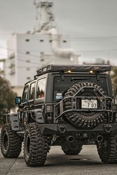 an off - road vehicle is parked on the street