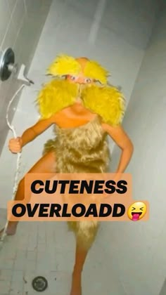 a woman in a chicken costume is standing on the shower head and has her hands behind her back