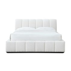 a white bed with an upholstered headboard and foot board on the side