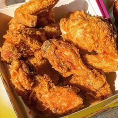 fried chicken in a box on a table