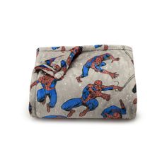 a spiderman print blanket on a white background