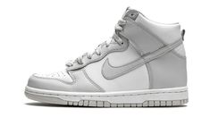 The Nike Dunk High GS “Vast Grey” is the youth sizing of the understated colorway for the venerable high-top shoe.  This February 2021 colorway dubbed “Vast Grey” keeps a simple and versatile two-tone white and grey color block, a design ethos shared by some of the greatest Dunk styles of all-time.  White leather forms the base of the upper, appearing on the perforated toe and the mid-panel, collar, and heel.  Vast Grey leather overlays, which includes a Swoosh logo on either side of the shoe, f High Tip Nike, Nike Dunks High Aluminum, Grey Nike High Dunks, Nike Dunk High Women, Nike Dunks High, Dunks High, Cute Nike Outfits, Nike High Tops, Jordan Shoes Girls