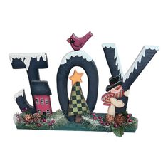 the word love is made out of wood and decorated with christmas decorations, including a bird