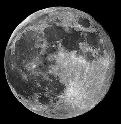 the full moon is shown in black and white