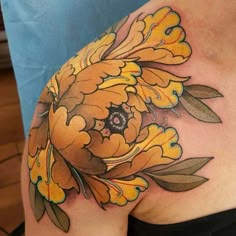 a woman's stomach with yellow flowers on it