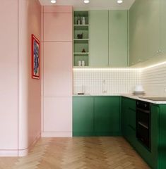 a kitchen with green cabinets and pink walls