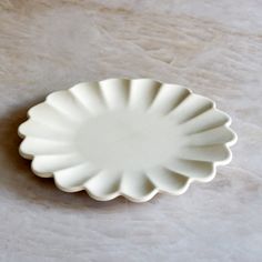 a white plate sitting on top of a table