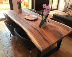 a wooden table sitting in the middle of a living room