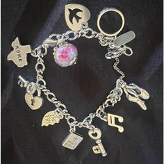 This Sterling Silver Charm Medium Bracelet (Approx 71/4 Inches) Is Made With A Special Twist. Add Your Personal Charm Collection And Let It Tell Your Life's Story. Great Condition * Lobster Clasp Closure * With 10 Charms Listed In Order 1. Ballet Shoes 2. Musical Note 3. Key 4. Bible 5. Half Of Friendship Heart 6. Heart With Key 7. Texas Map 8. Pink Flower Enamel 9. Heart With Dove 10. Crown James Avery Charm, Medium Twist, Friendship Heart, James Avery Charms, James Avery Jewelry, Texas Map, Charm Collection, Sterling Silver Charm Bracelet, James Avery