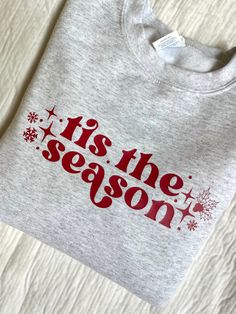 50% Cotton 50% Polyester Fleece Sweatshirt This Christmas Sweatshirt features a gray sweatshirt with a red "tis the season" design.  This item is customizable! Make it a custom Christmas Sweatshirt with personalized sweatshirt colors, design colors, and text. Available upon request, please send me a message if interested. Note that personalization may affect cost of product and shipping timeline. Tis The Season Sweatshirt, Sweatshirt Design Ideas Vinyl, Cricut Christmas Sweatshirts, Vinyl Sweatshirt Ideas, Christmas Sweatshirts Vinyl, Sweatshirt And Shirt Outfit, Outfit Ideas Shirt, Christmas Sweatshirt Ideas, Sweatshirt Design Ideas