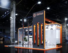 an exhibition stand with lights on the ceiling