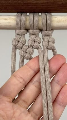 someone is holding the end of a piece of rope