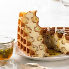 the waffles have been cut in half and are ready to be eaten with honey