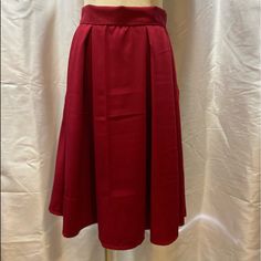 Burgundy Rockabilly Pleated Skirt Knee Length 50’s Vintage Style A-Line Flared Swing Size Small Back Zipper Pockets Excellent New Never Worn Approximate Measurements Laying Flat: Waist: 14" Length: 24" Classic Midi Party Skirt, Classic Midi Skirt For Party, Classic Red Skirt, Vintage Red Skirt For Party, Vintage Red Party Skirt, Red Long Pleated Skirt For Party, Red Pleated Party Skirt With Lining, Retro Knee-length Party Skirt, Retro A-line Skirt For Party