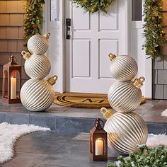 christmas decorations on the front steps of a house