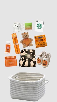 the contents of a travel bag are arranged on a gray background, including an orange and white teddy bear