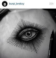 an all seeing eye tattoo on the chest