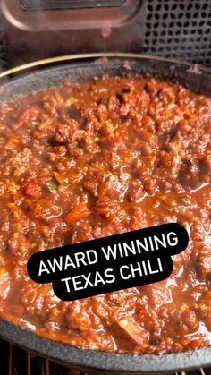 the award winning chili has been placed on top of an open grill with it's name