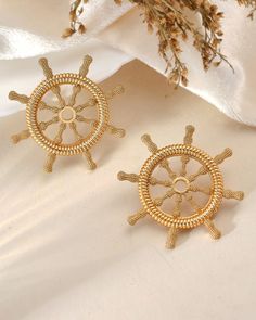 Sterling Silver Ship Wheel Stud Earrings, 18k Gold Plated Ship wheel earrings, Captains wheel earrings, nautical stud earrings, Gift For Her.  ▷ MATERIAL ★ All of our silver jewelry is 925 sterling silver and 18 carat gold plated. (Our white silver jewelry is rhodium plated.) ★ Brass with 18 carat gold plated. Introducing our stunning chunky ship wheel earrings, crafted with meticulous attention to detail in either sterling silver or brass, designed to capture the essence of nautical charm and e Cruise Earrings, Nautical Jewelry Seashurjewelry, Nautical Style Anchor Gold Jewelry, Nautical Anchor Gold Jewelry, Nautical Earrings, Creating Jewelry, Wedding Jewelry Earrings, White Silver, Wedding Earrings