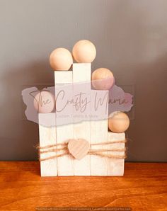 a wooden block with some hearts on it and a sign that says the crafty men