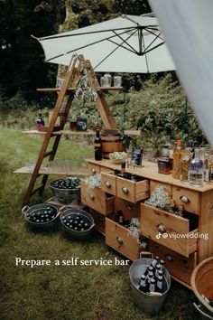 an outdoor bar is set up in the grass