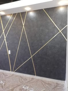 the wall is being painted with gold lines