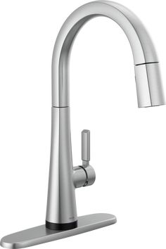 a kitchen faucet with chrome finish on the side and an angled spout