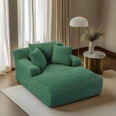 a living room with a large green couch