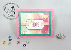 a close up of a card on a table with some beads and other items around it