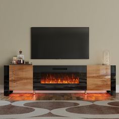 an entertainment center with a television mounted on the wall and a fire in the fireplace